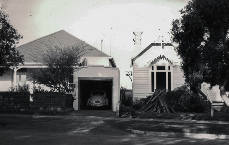black and white photgraph show part of two houses